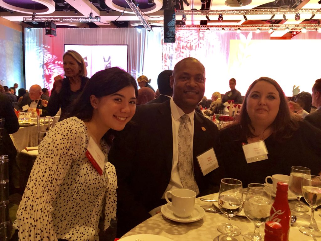 Coca-Cola Scholarship winner with Team Atlanta at dinner table