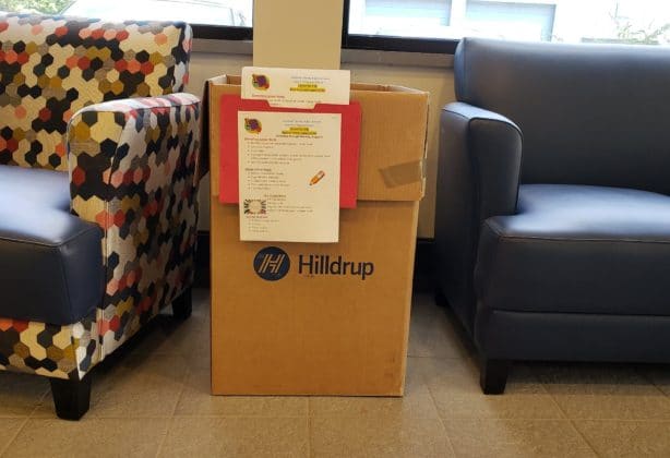 A Hilldrup box that holds donations for a school drive.
