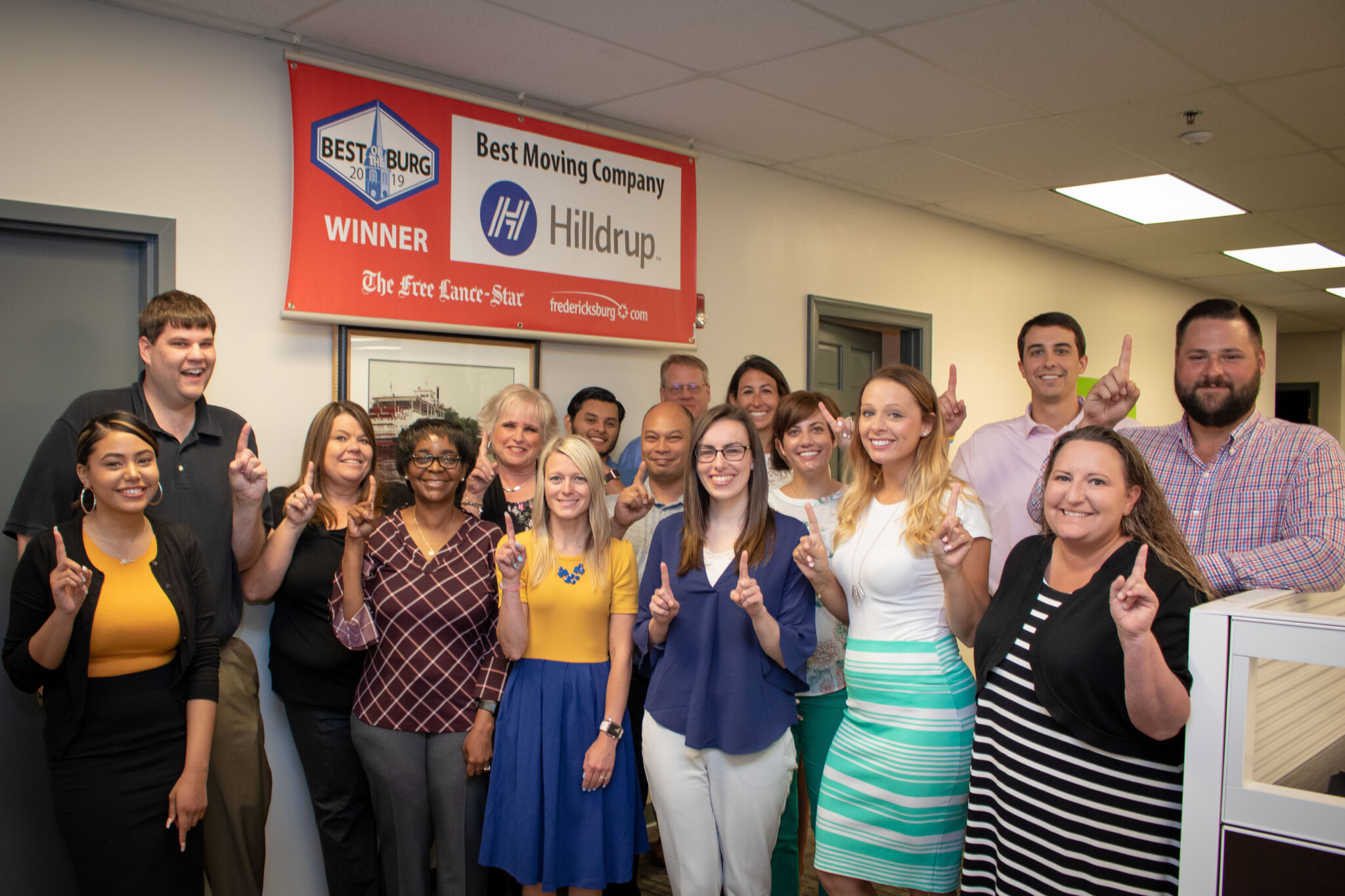 Hilldrup employees raise a "#1" in support of Hilldrup being named the Best Moving Company in the Fredericksburg area.
