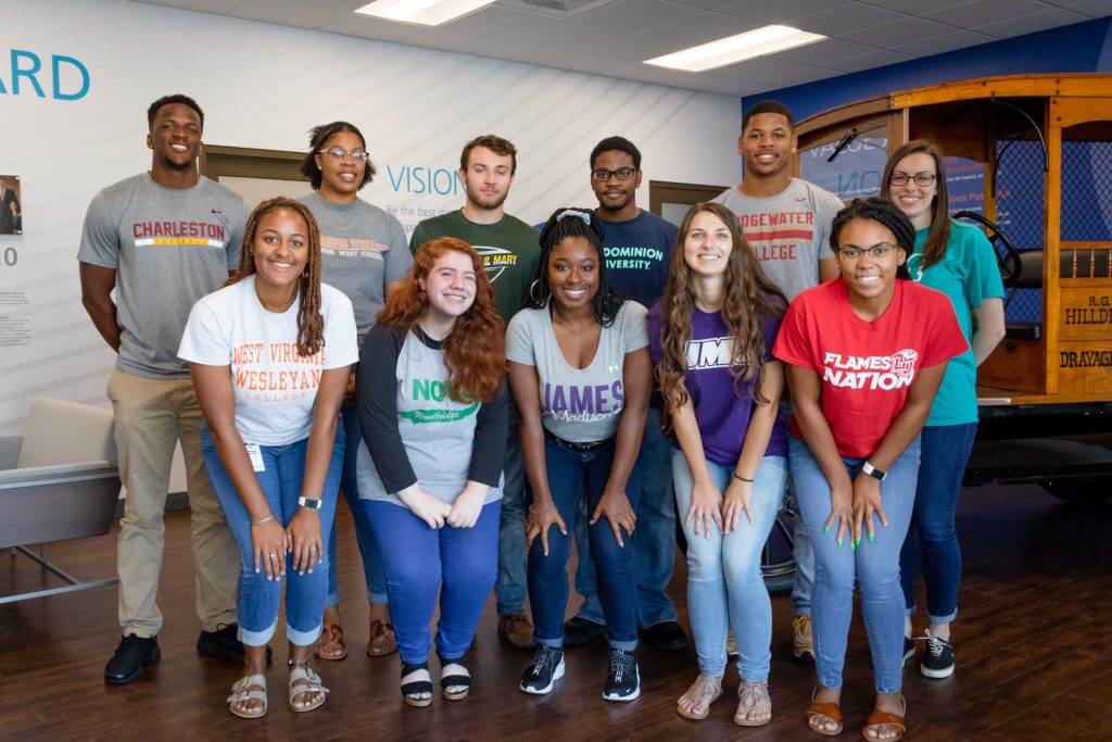 Summer interns wearing their college t shirt to work