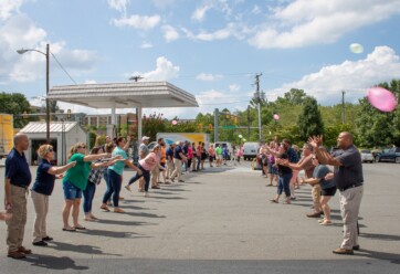 Hilldrup employees participating in a waterballoon toss.