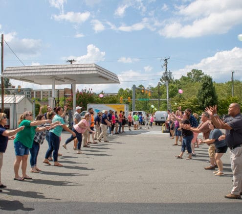 Hilldrup employees participating in a waterballoon toss.