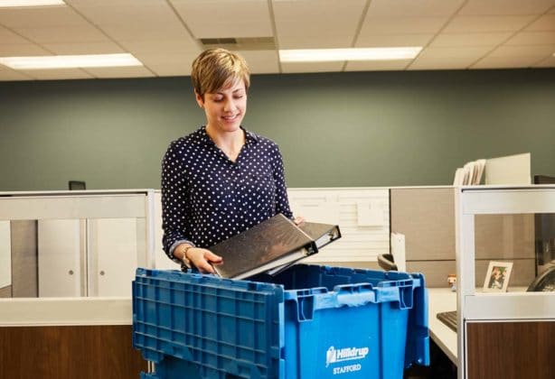 Employee packing a crate