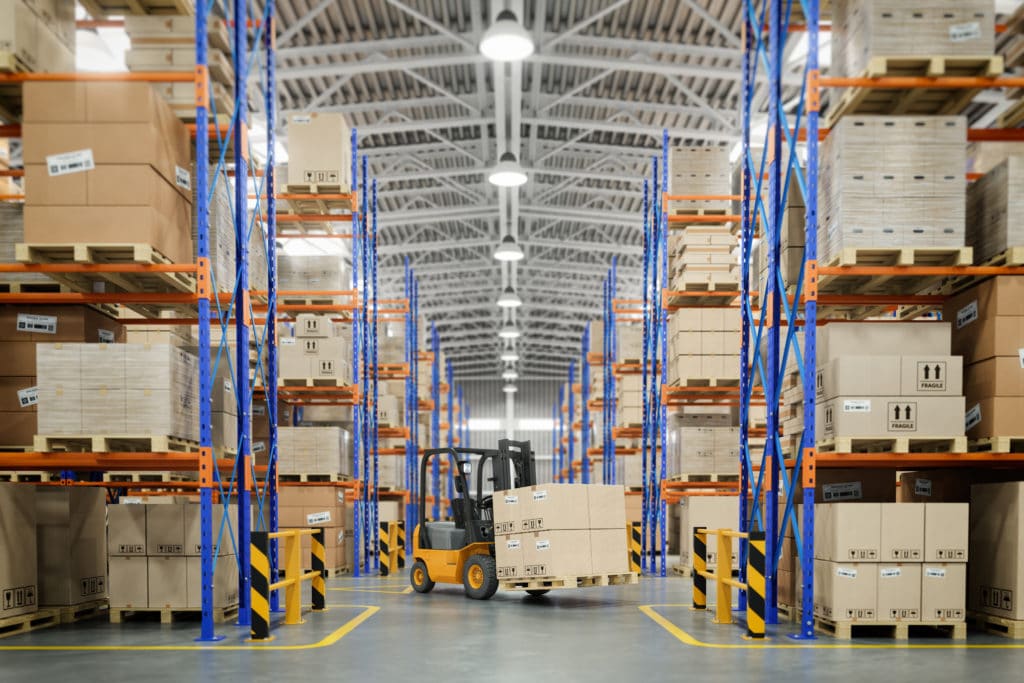 Forklift truck in warehouse or storage and shelves with cardboard