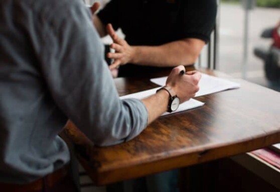 Two people collaborating at a table