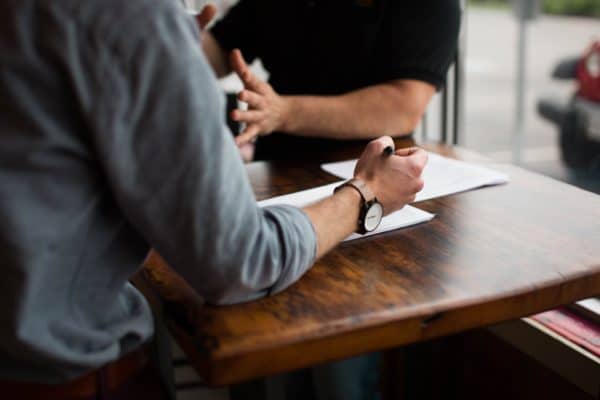 Two people collaborating at a table