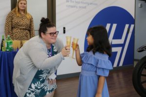 A teacher and her student celebrate with a 