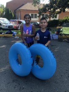 Two children drinking water