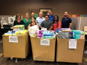 Hilldrup Orlando team members with donations supplied for the Hurricane Relief Fund
