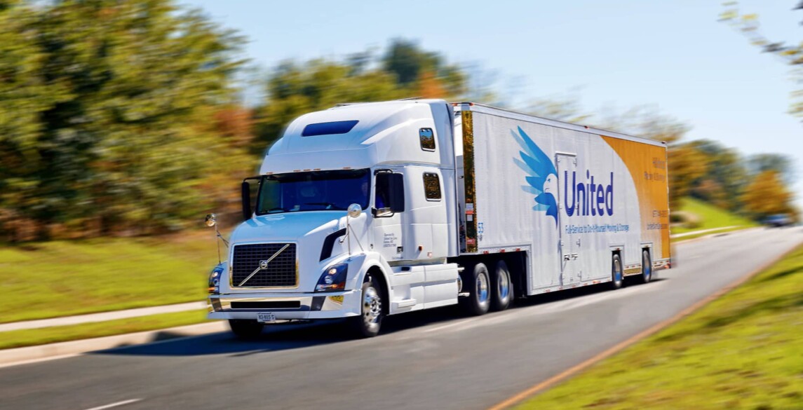 A Hilldrup truck driving down the road