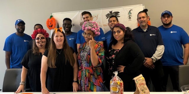 Group photo of Atlanta employees dressed up for Halloween