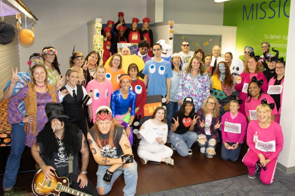 group photo of Stafford employees dressed up during 2019 Halloween