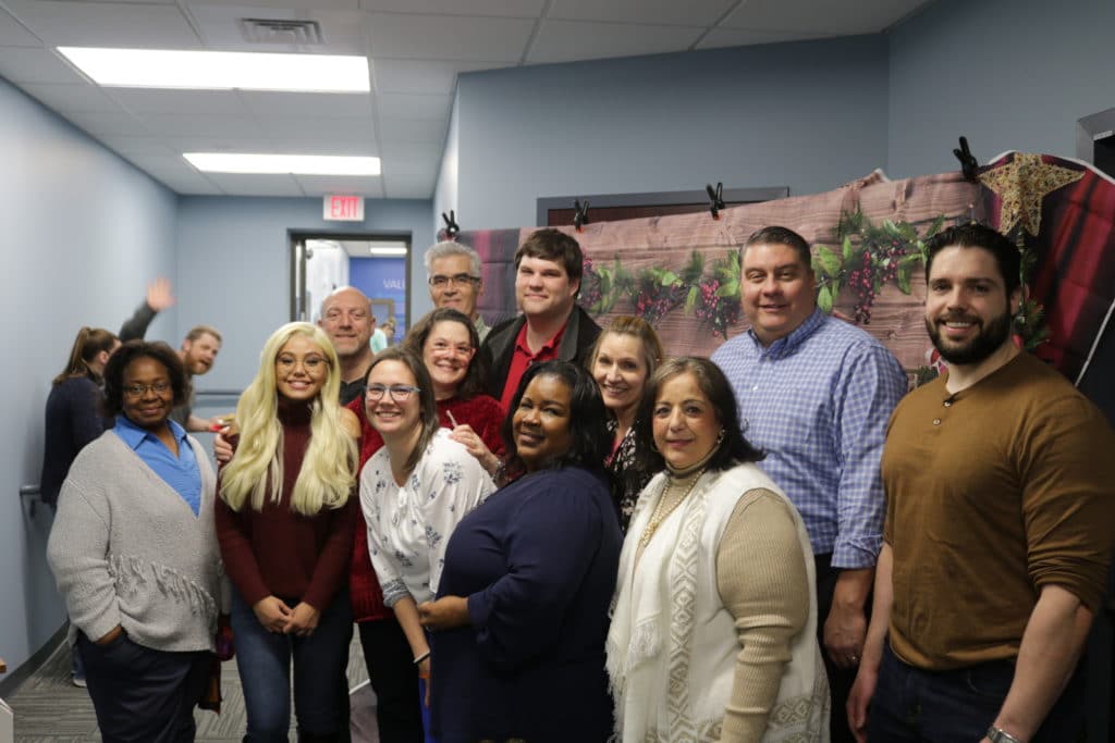 Hilldrup's International team gathers for a photo together during the Christmas party. 