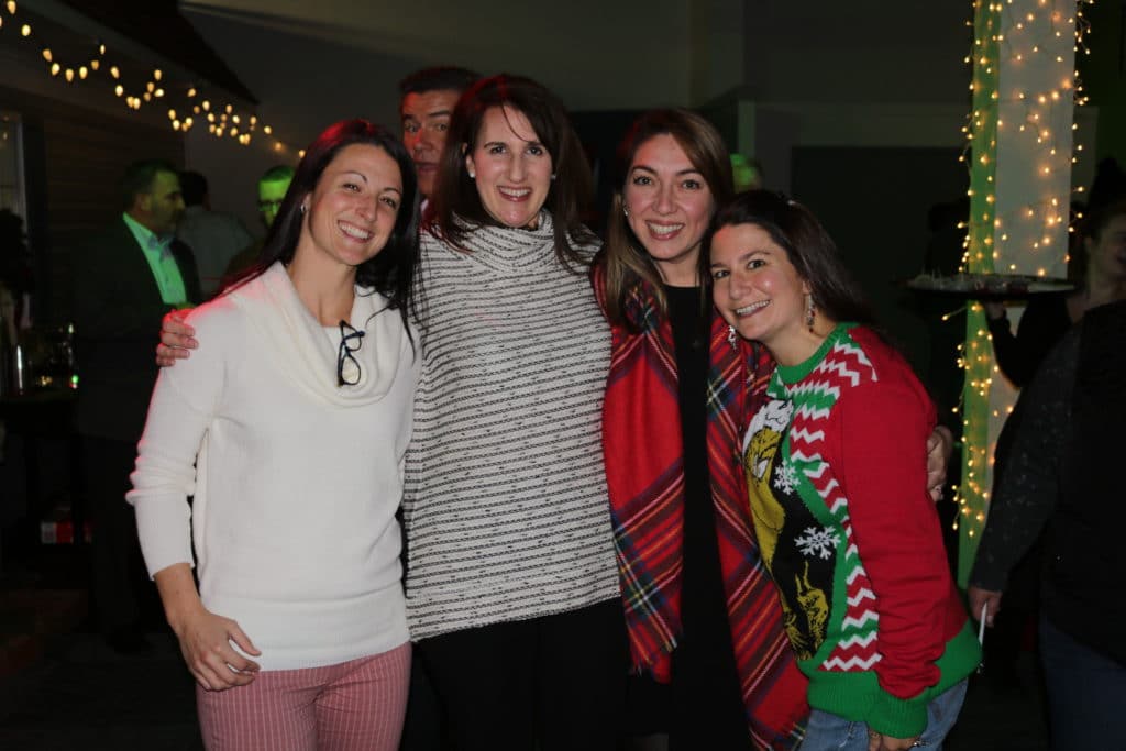 Christy, Stephanie, Tatiana and Heather of our Relocation Dept gather for a photo together during the Christmas party. 