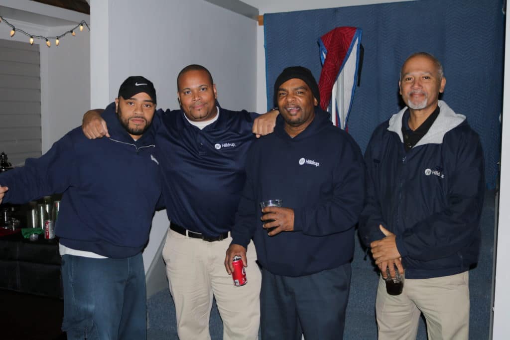 Sid, Caesar, James and Darrell of our Operations team gather for a photo during Hilldrup's Christmas party. 