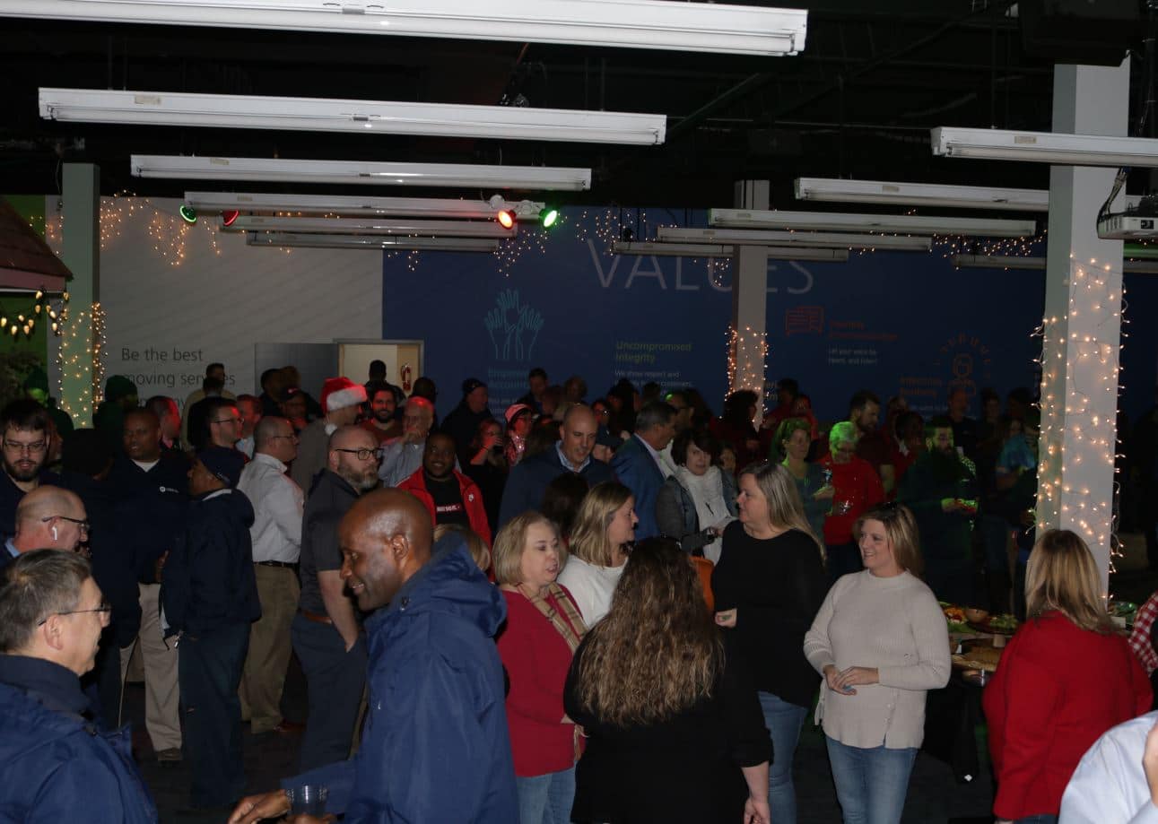 Hilldrup employees gather in front lobby during our company Christmas party