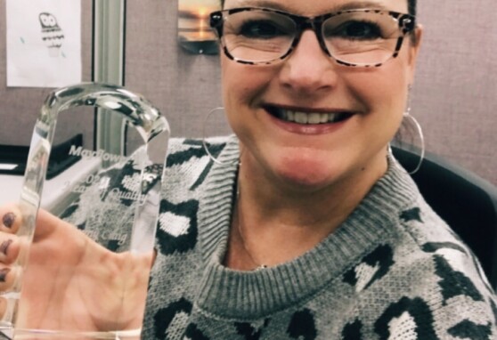 Jenny Craig holds her Heart of Quality Award