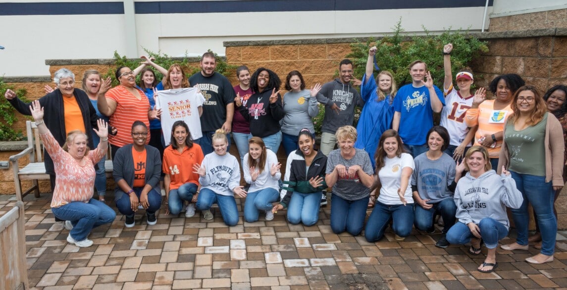 Hilldrup Stafford employees dressed in their favorite local sports team tshirts