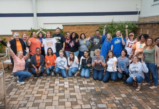 Hilldrup Stafford employees dressed in their favorite local sports team tshirts