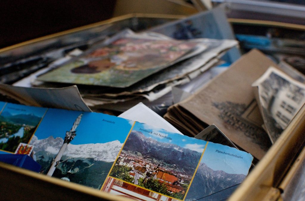Box filled with old papers, documents, postcards, files