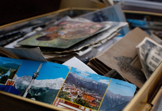 Box filled with old papers, documents, postcards, files