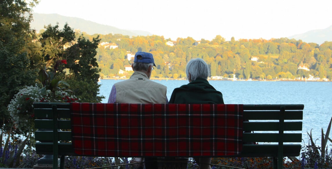 Older Couple looking at view of trees and water