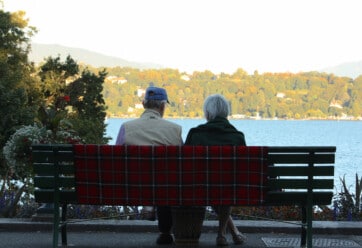Older Couple looking at view of trees and water
