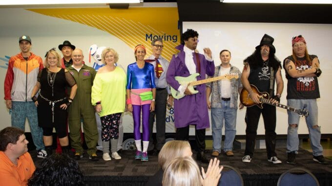 Hilldrup's Senior Management Team dresses in 80s themes costumes for Halloween