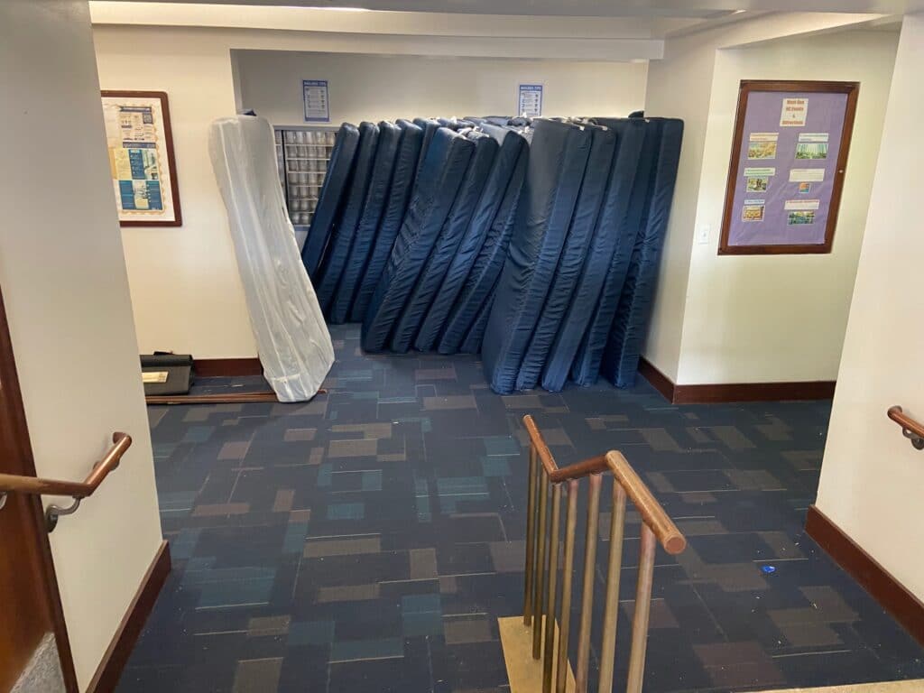 Mattresses in Thurston Hall at GWU's campus are gathered for loading. 