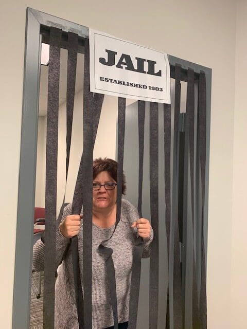 Crystal Brinson participates in "Hilldrup Jail" at the office in the spirit of a RUW activity. 