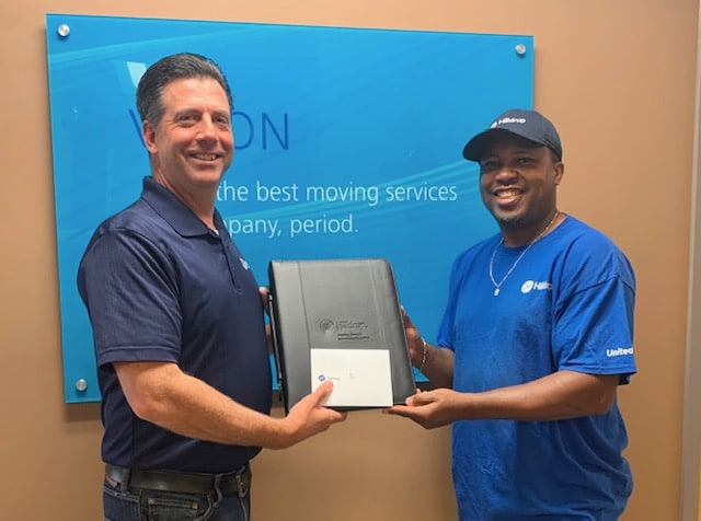 Chris Scheier gives Van Operator Rico Acker a giveaway during Van Operator Appreciation Week. 