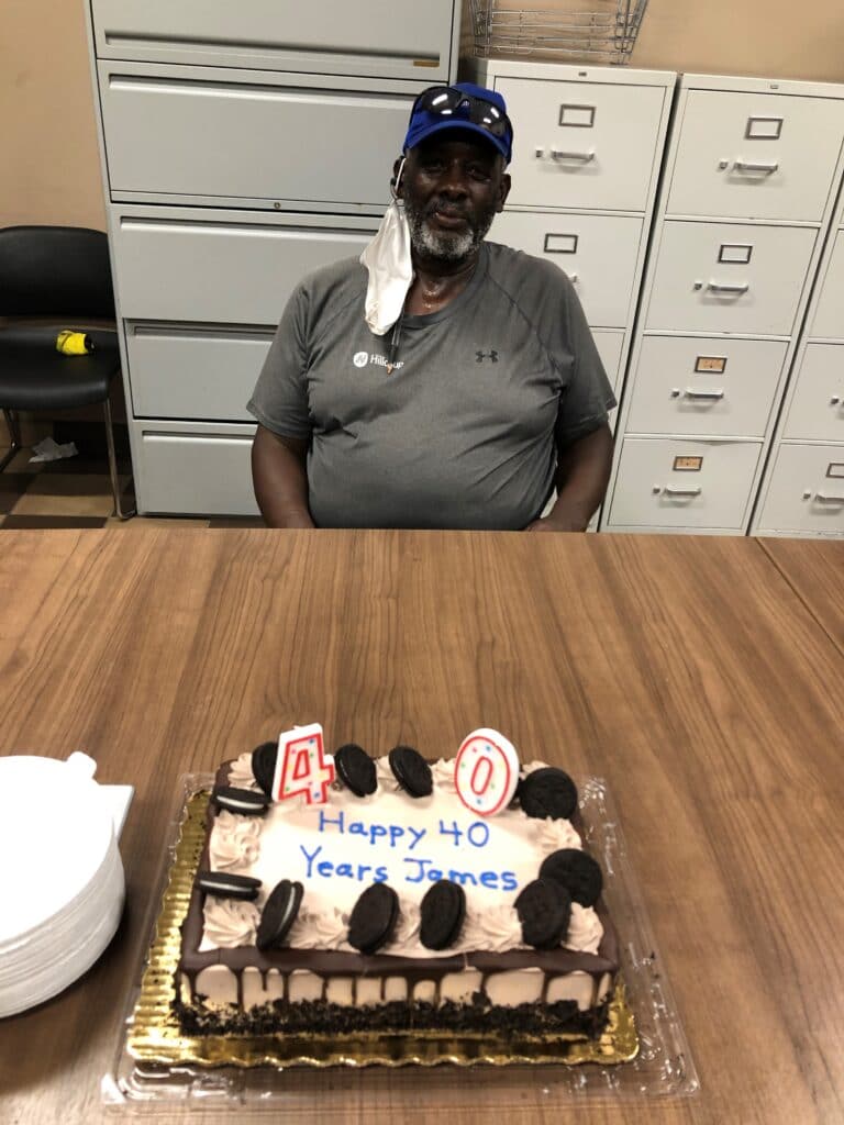 James Lewis enjoys a celebration of honoring his 40 years of service to Hilldrup at Orlando's office. 