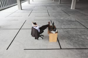 Employee admiring the workplace layout of his office.