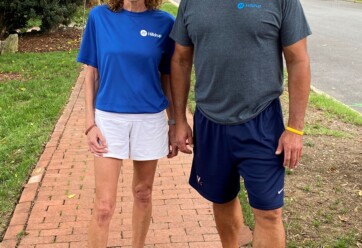 Charles and Tricia standing together in Hilldrup shirts