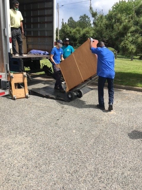 Hilldrup Richmond loads furniture into our truck for CARITAS