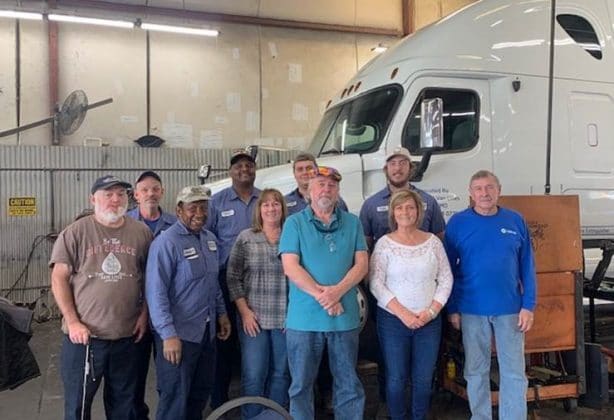 Hilldrup's Shop team joins Ron Lewis for a photo during his retirement celebration.