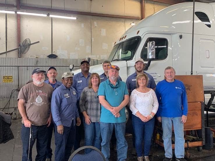 Hilldrup's Shop team joins Ron Lewis for a photo during his retirement celebration.