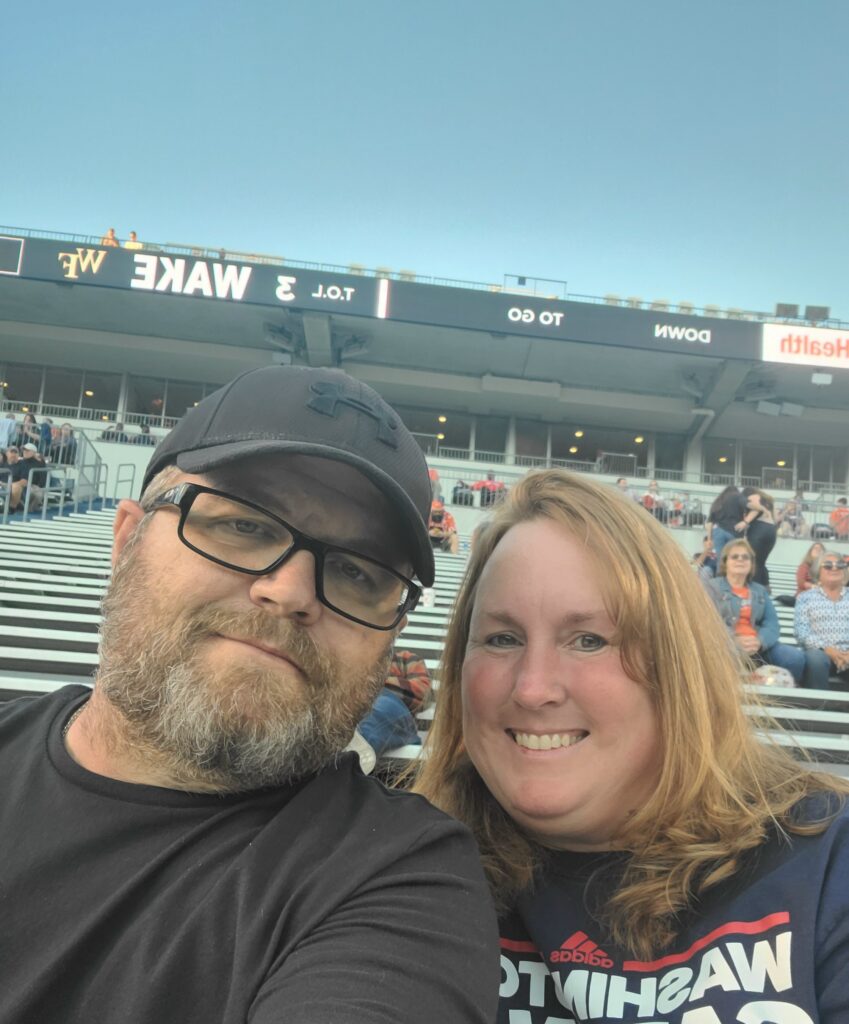 Robin Allison-Jones at the UVA game with loved one. 