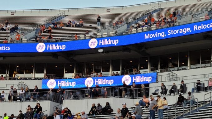 Hilldrup's Chris Nelson prepares to get the UVA crowd ready for trivia during the game.