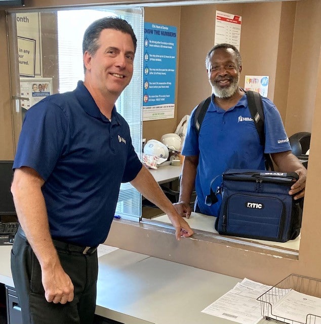 Chris Scheier and Anthony Anderson during Van Operator Appreciation Week 