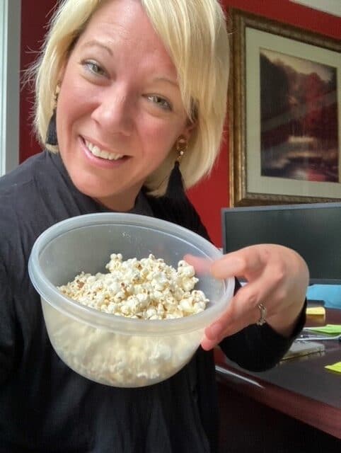 Kristen Wells with a bowl of popcorn