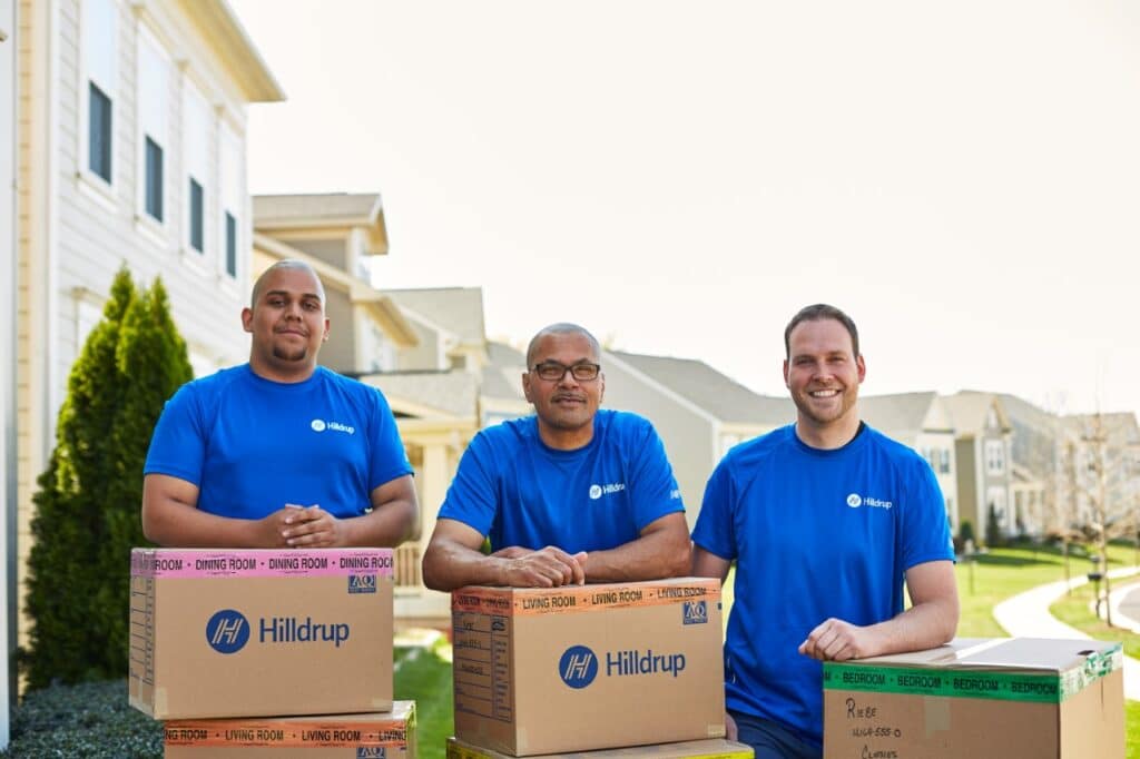 crew members standing behind boxes