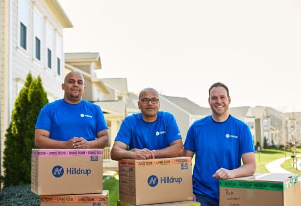 crew members standing behind boxes