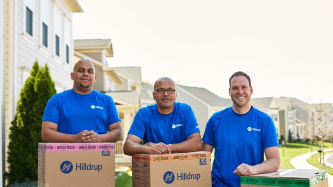 crew members standing behind boxes