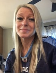 headshot of woman in football jersey