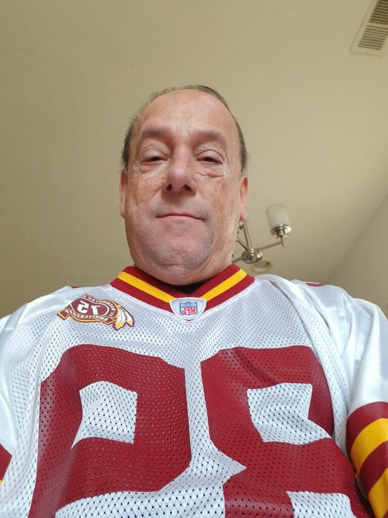 headshot of man in football jersey