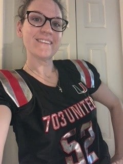 headshot of woman in football jersey