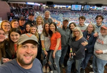 Group of people in suite at basketball arena