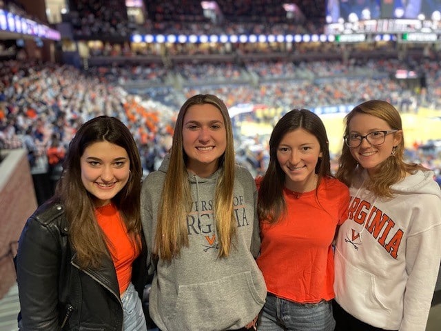 Friends in basketball arena