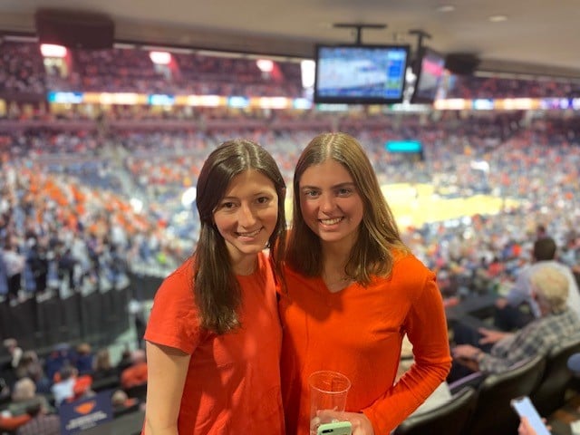 Friends in basketball arena